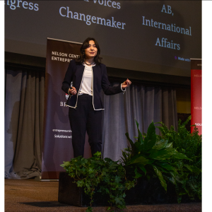 Student pitching on stage