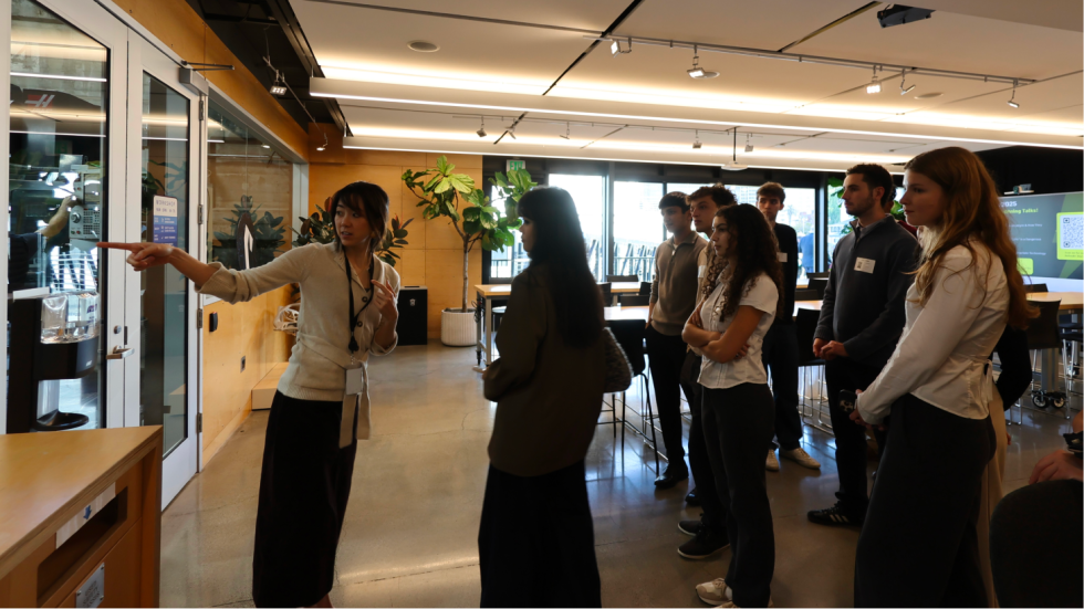 Group of students listening to someone talk